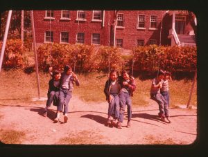 Students on the swingset, Cecilia Jeffrey School, c.1965 (G-84-SC-49)