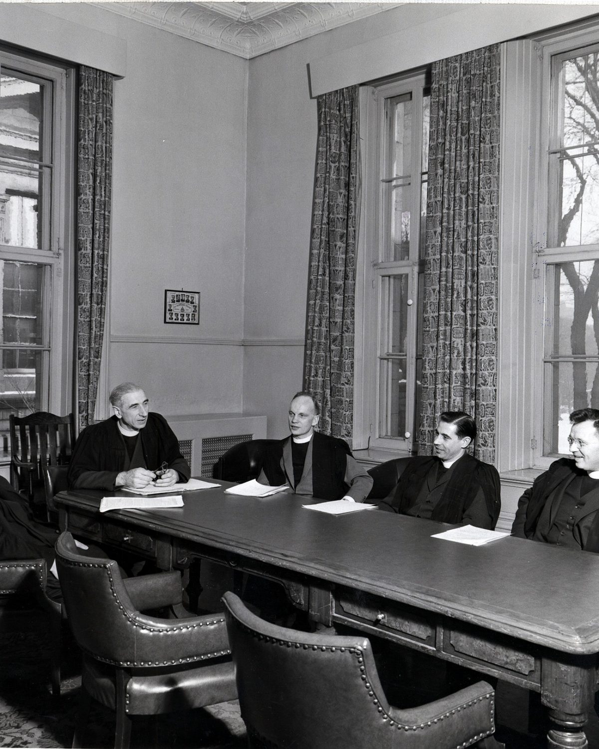 The Faculty of The Presbyterian College sitting in a room in the Old College Building
