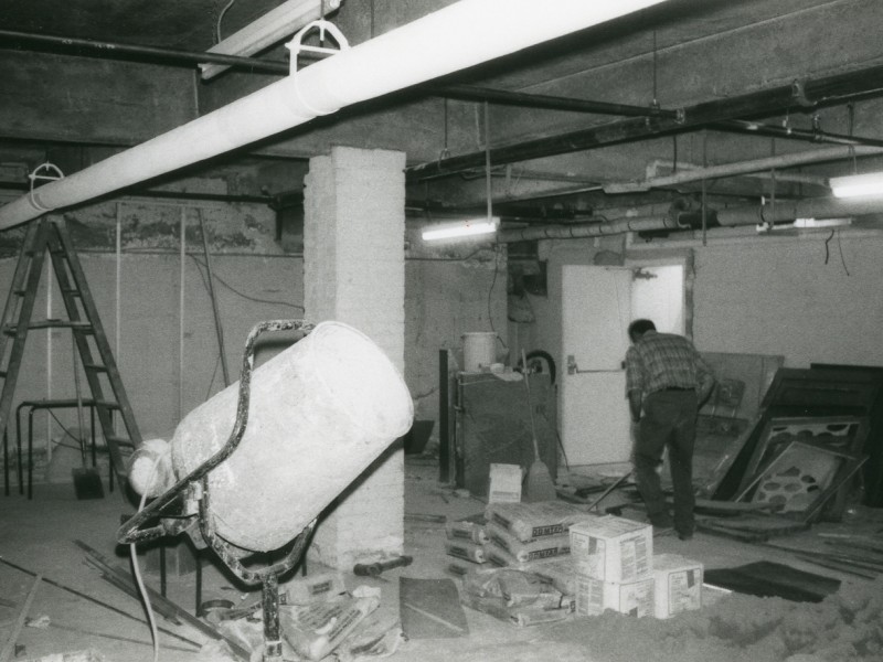 A man working on renovations in the College