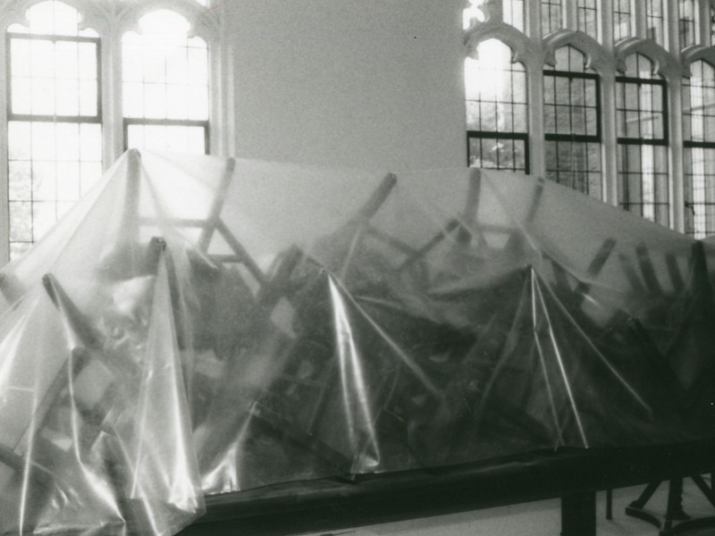 Chairs stacked on top of a table and being protected during the renovations in the 80's
